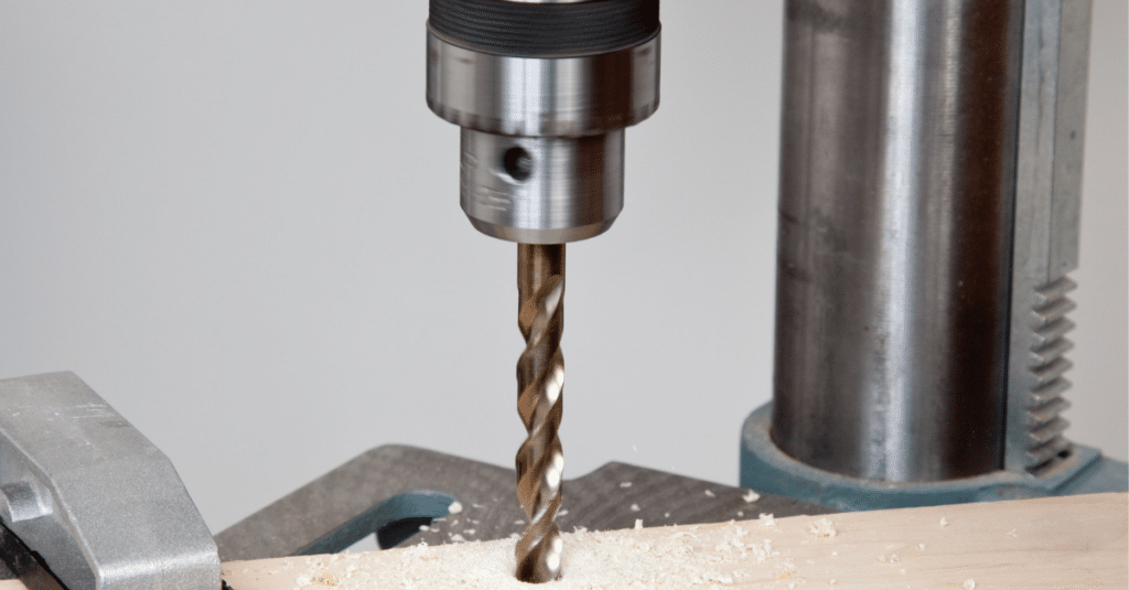 Drill drilling into a piece of wood