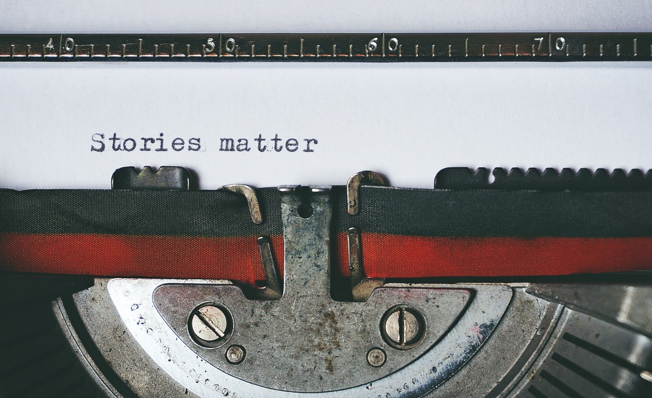 typewriter with stories matter written on paper